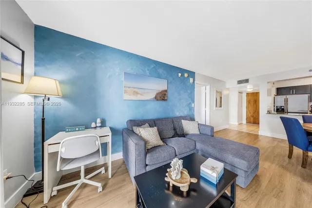 a living room with furniture and a table