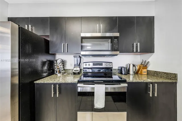 a kitchen with a stove and a microwave