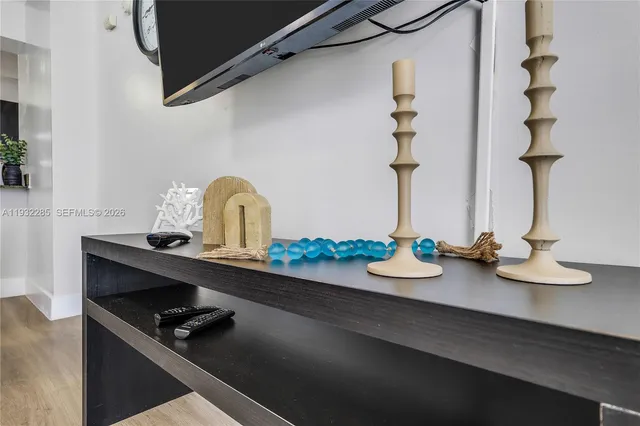 a table with chairs and wooden floor