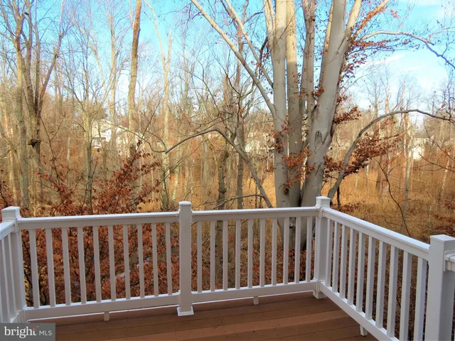 a view of balcony with wooden floor