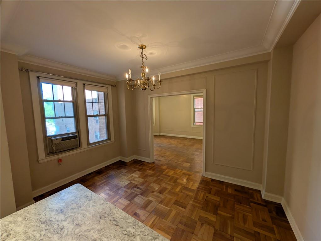 144 North Dithridge Street, Unit 403 Pittsburgh, PA 15213 - Photo 7 of 31 a view of a big room with windows and chandelier