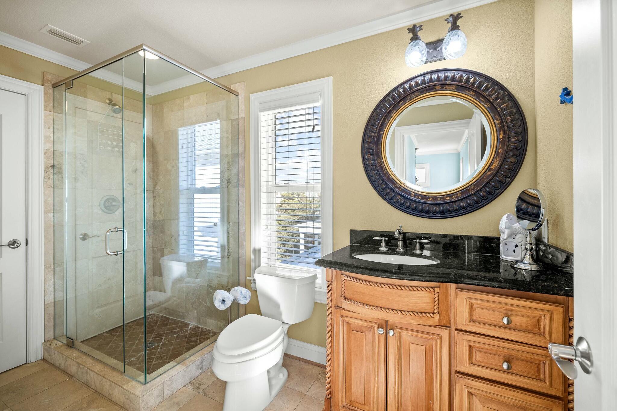 136 Surfer Lane Inlet Beach, FL 32461 - Photo 33 of 50 a bathroom with a sink a mirror a toilet and a shower