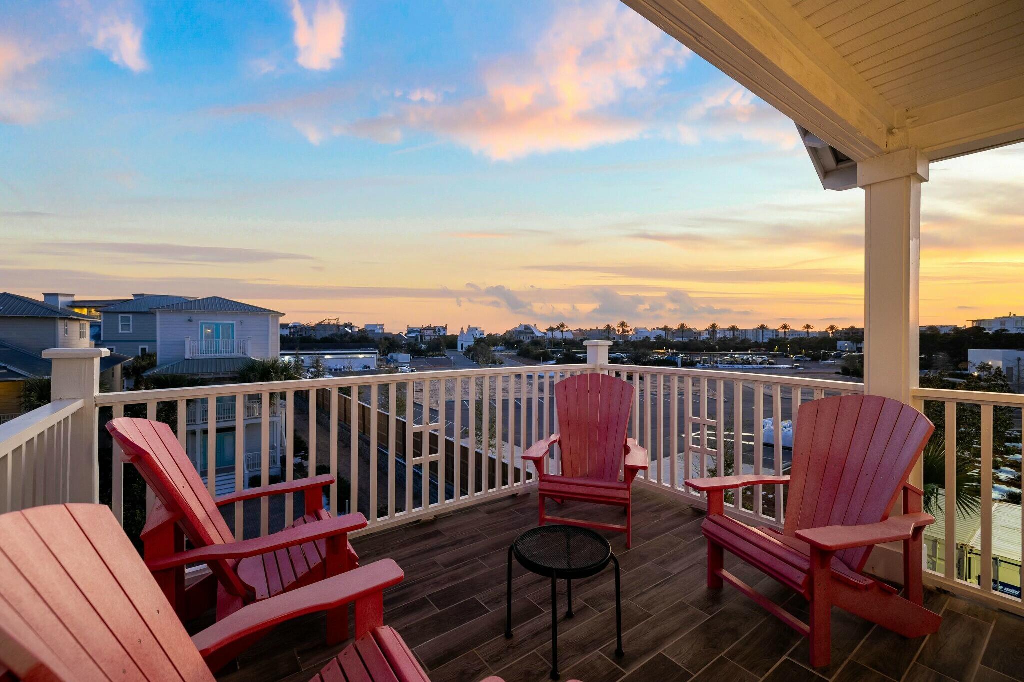 136 Surfer Lane Inlet Beach, FL 32461 - Photo 4 of 50 a view of a balcony with wooden floor table and chairs