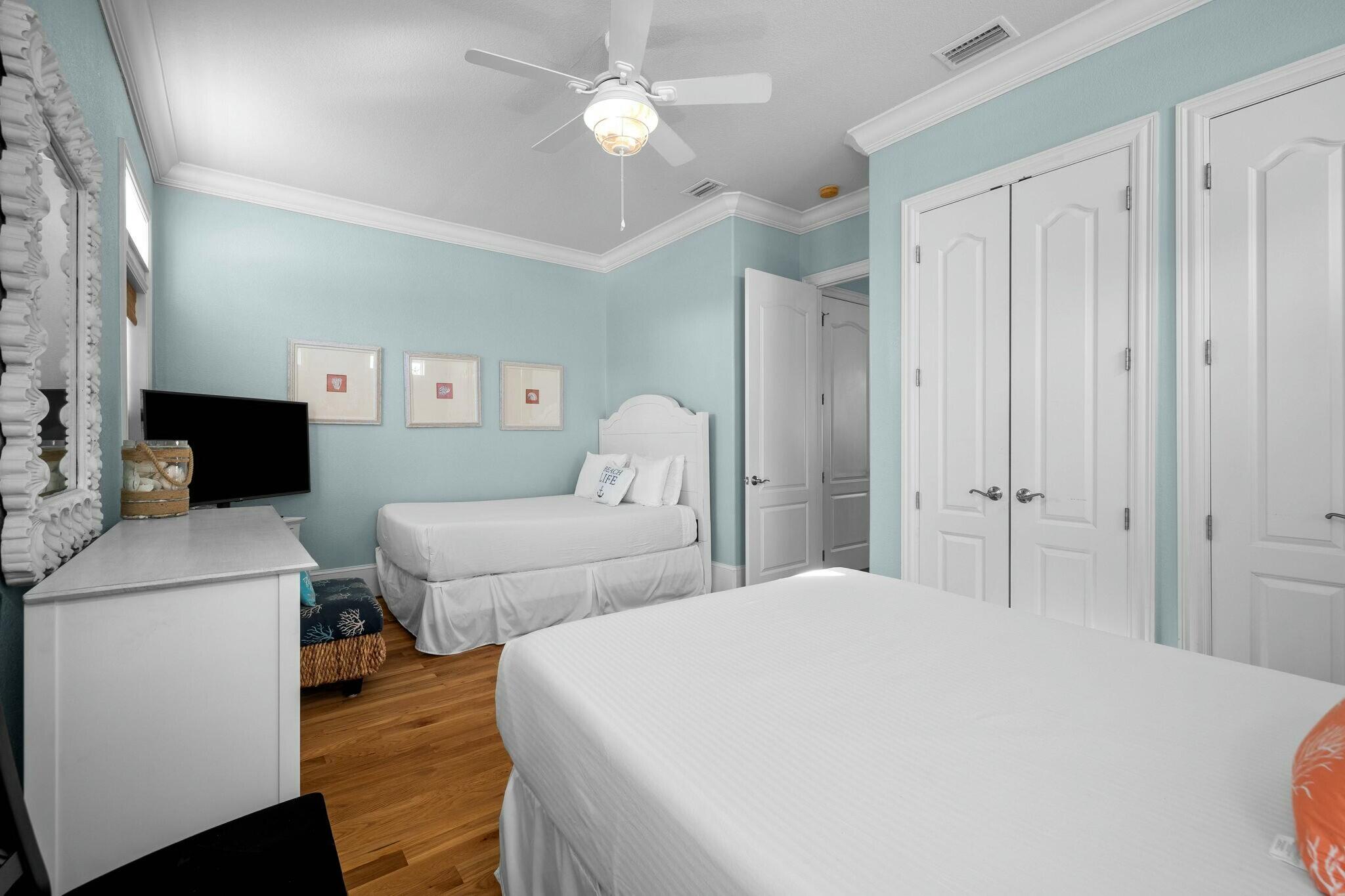 136 Surfer Lane Inlet Beach, FL 32461 - Photo 9 of 50 a spacious bedroom with a bed and a flat screen tv