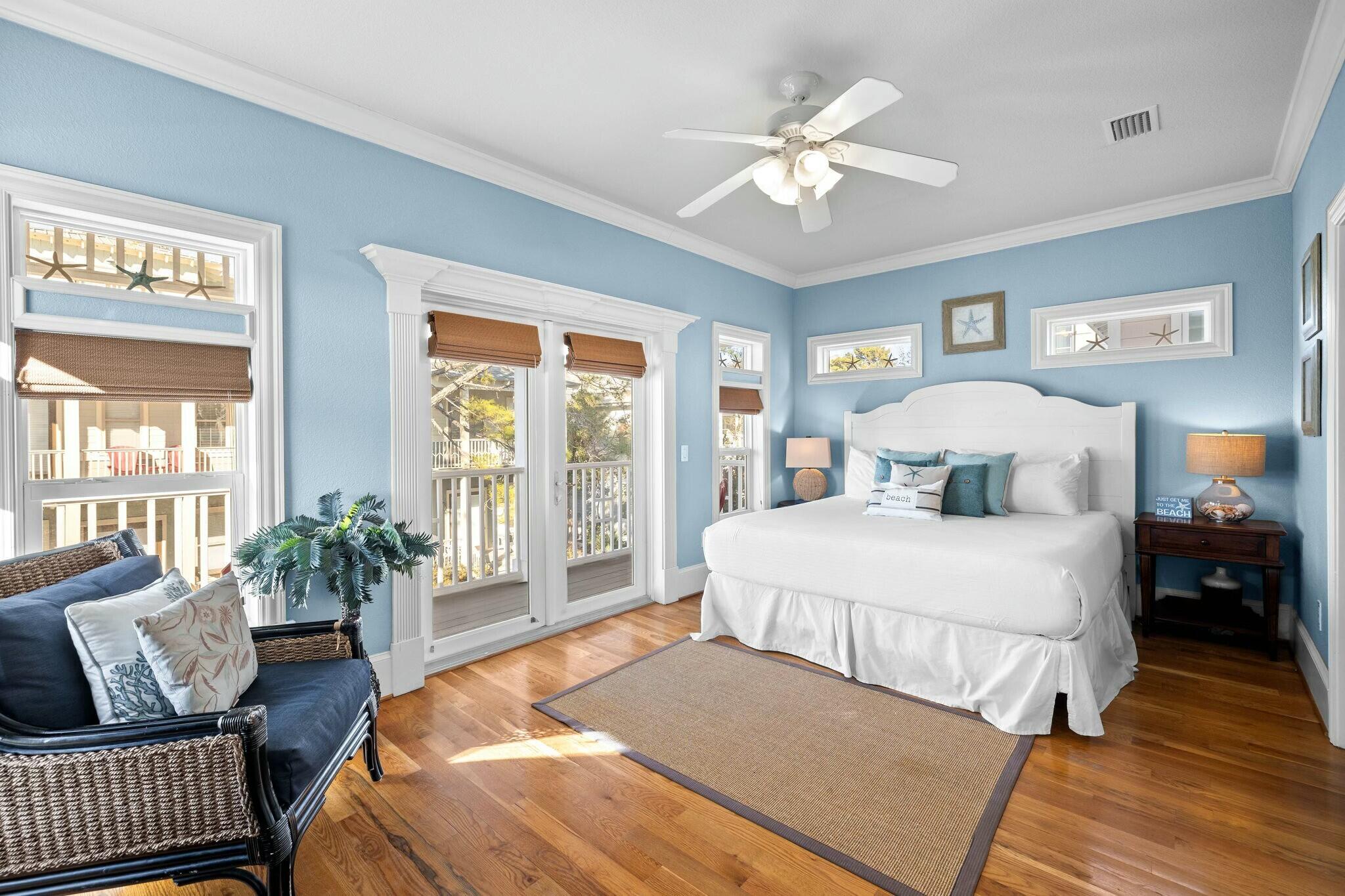 136 Surfer Lane Inlet Beach, FL 32461 - Photo 10 of 50 a bedroom with a large bed and a chandelier