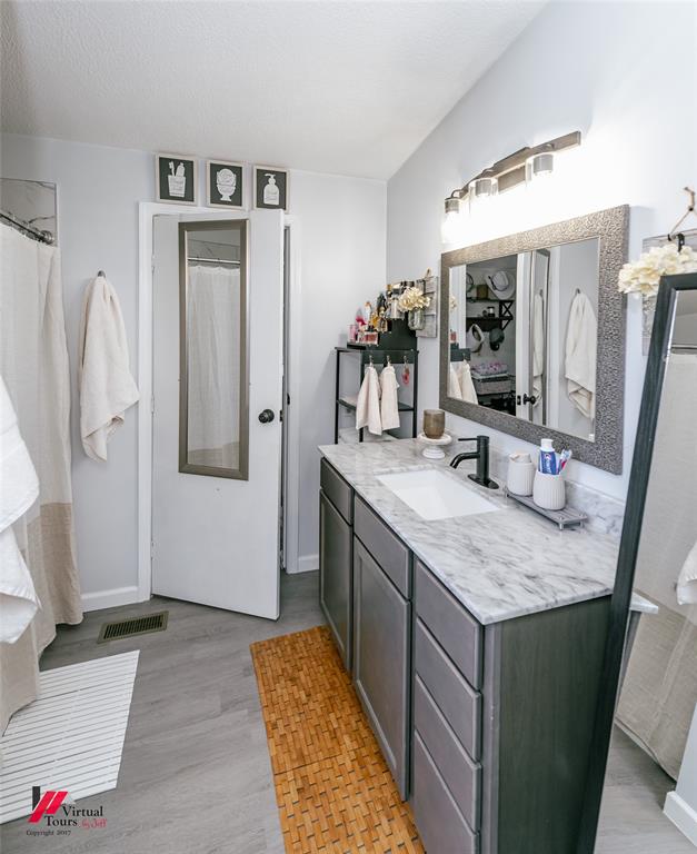 14631 Pecan Road Keithville, LA 71047 - Photo 19 of 40 a bathroom with sink and mirror