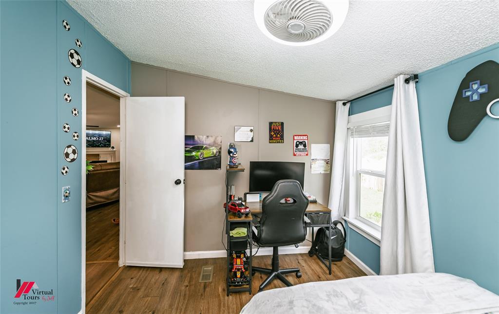14631 Pecan Road Keithville, LA 71047 - Photo 22 of 40 a workspace with furniture and wooden floor