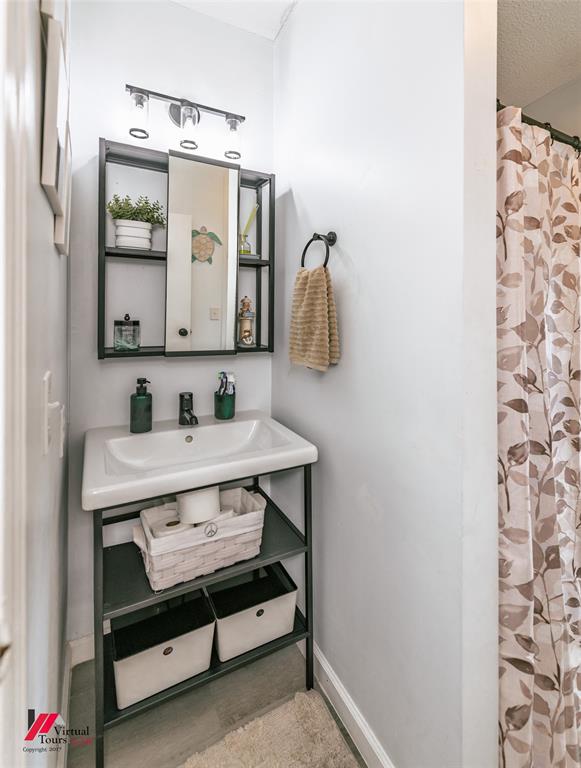 14631 Pecan Road Keithville, LA 71047 - Photo 24 of 40 a bathroom with a sink and a mirror