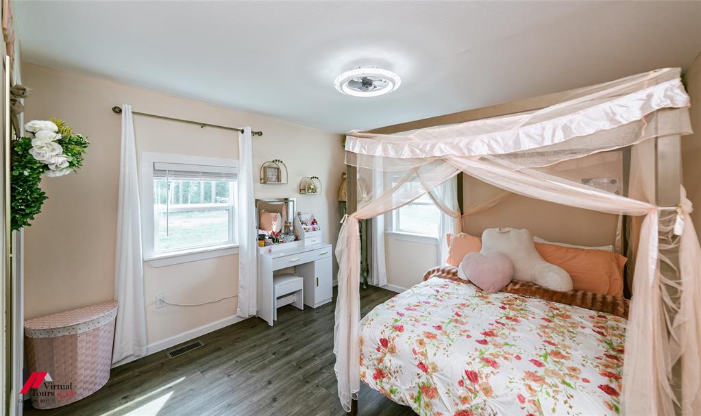 14631 Pecan Road Keithville, LA 71047 - Photo 28 of 40 a bedroom with a bed and a window