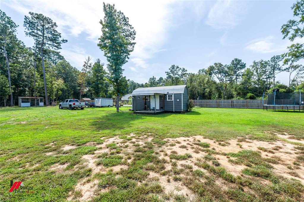14631 Pecan Road Keithville, LA 71047 - Photo 31 of 40 a view of a house with a big yard