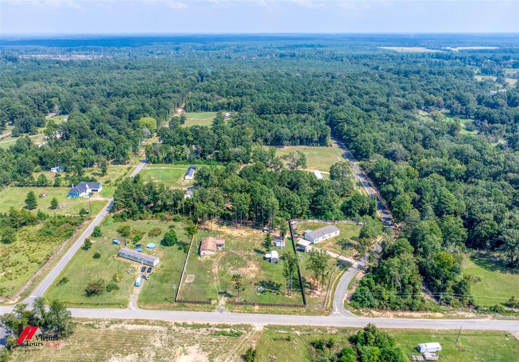 14631 Pecan Road Keithville, LA 71047 - Photo 39 of 40 an aerial view of a house with a yard