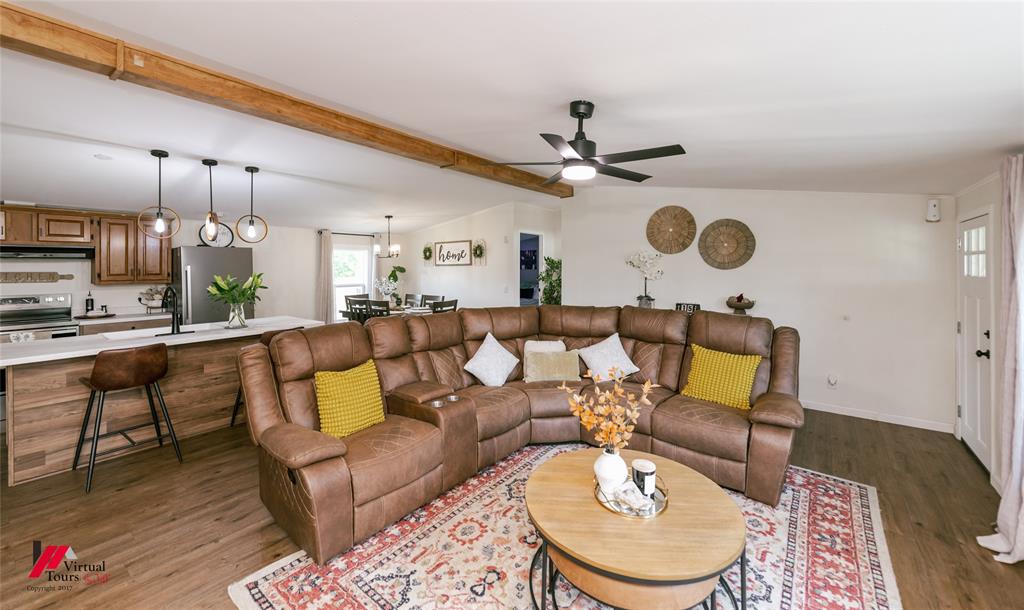 14631 Pecan Road Keithville, LA 71047 - Photo 6 of 40 a living room with furniture kitchen view and a chandelier