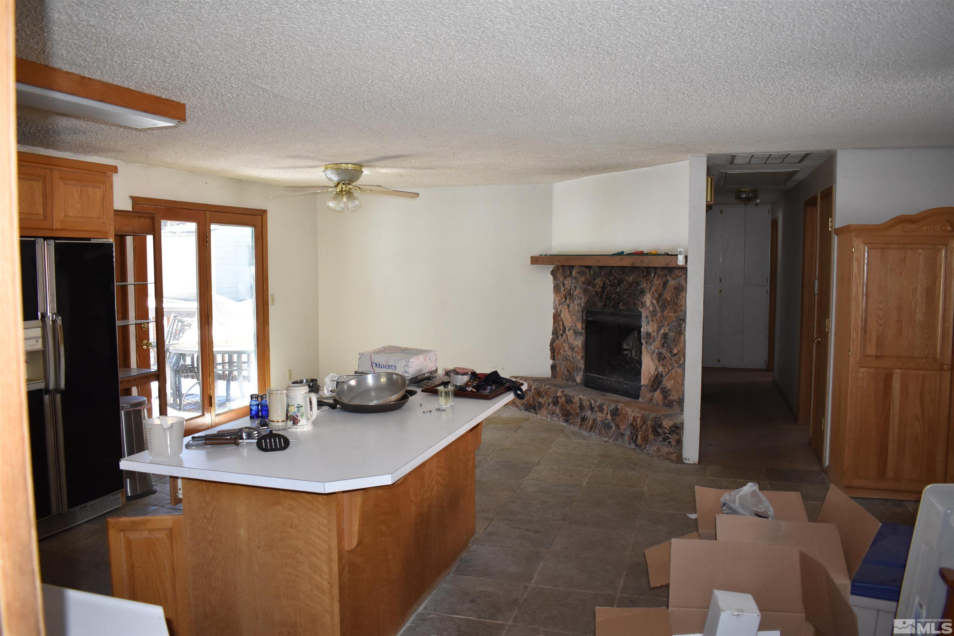 229 Sunflower Circle Stateline, NV 89449 - Photo 11 of 27 a dining room with furniture and a fireplace