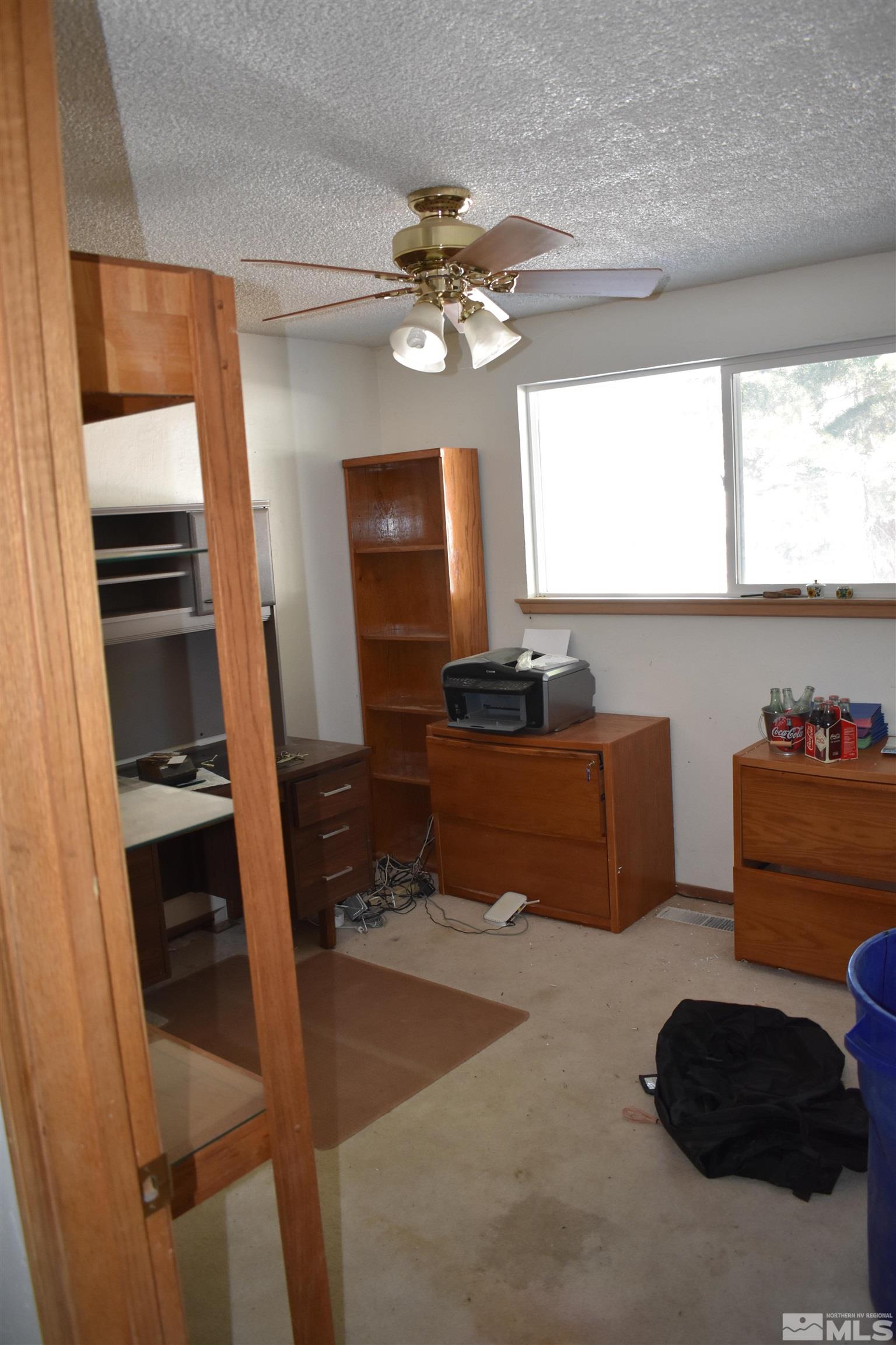 229 Sunflower Circle Stateline, NV 89449 - Photo 12 of 27 a living room with furniture and a flat screen tv