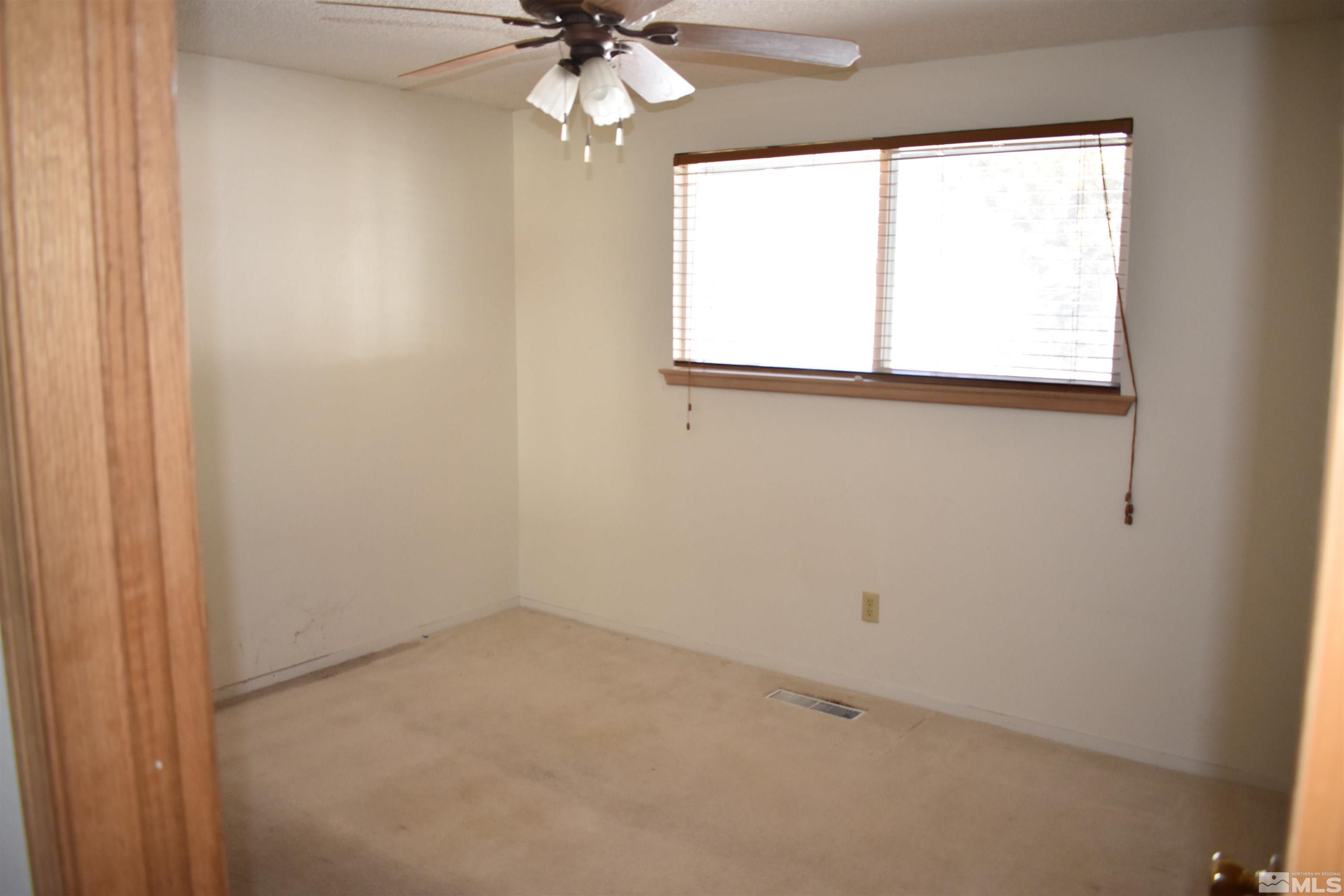 229 Sunflower Circle Stateline, NV 89449 - Photo 16 of 27 an empty room with a window