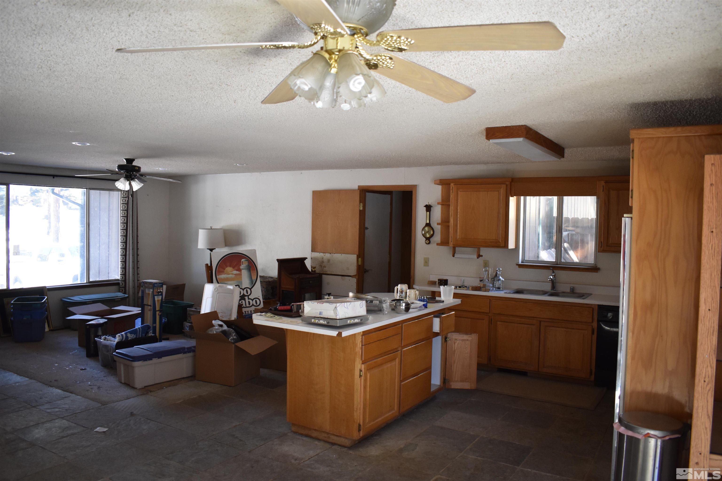 229 Sunflower Circle Stateline, NV 89449 - Photo 8 of 27 a kitchen with a stove a refrigerator and a sink