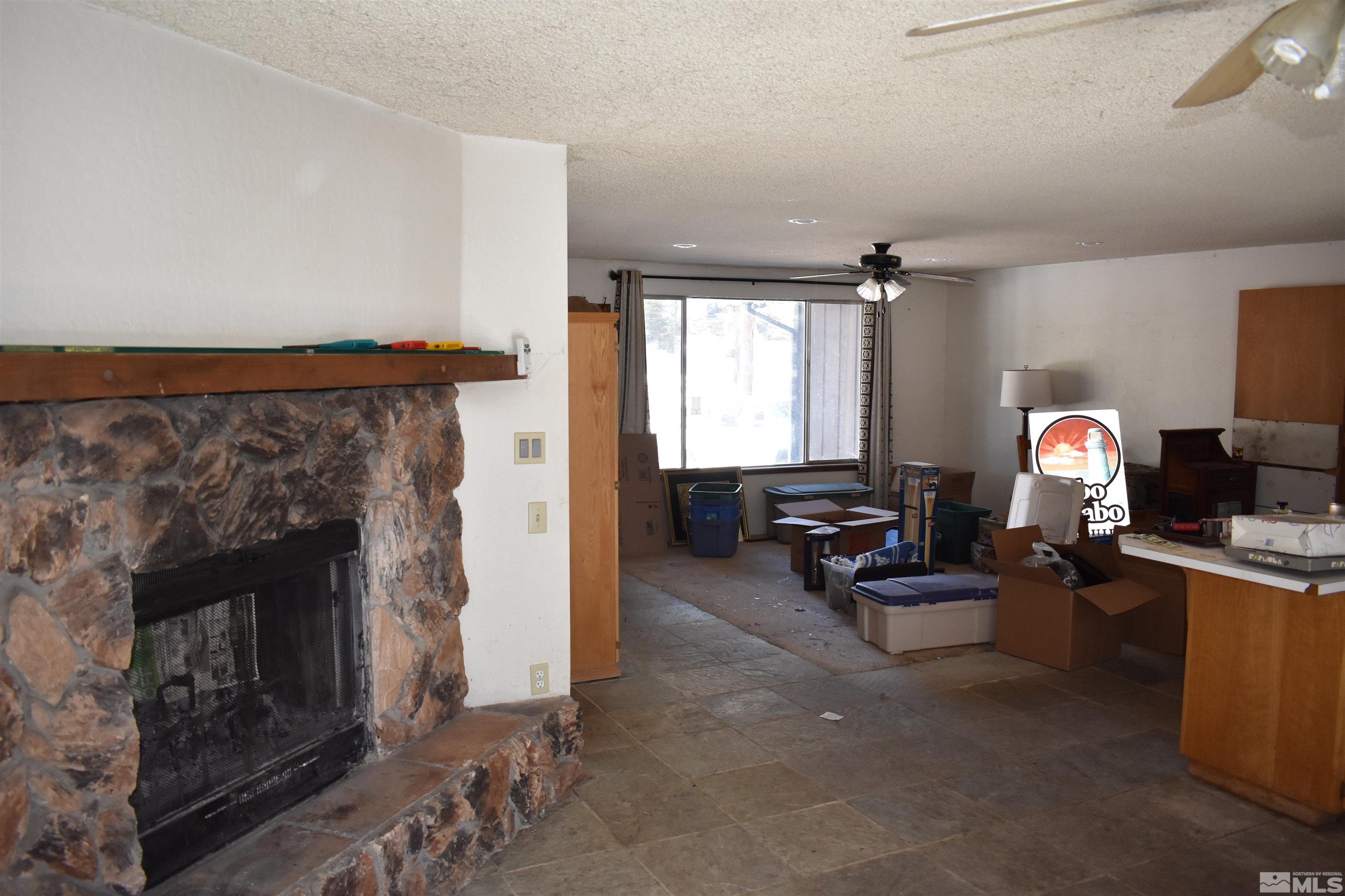 229 Sunflower Circle Stateline, NV 89449 - Photo 10 of 27 a living room with furniture and a fireplace