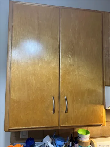 a bathroom with a granite countertop sink toilet and a shower