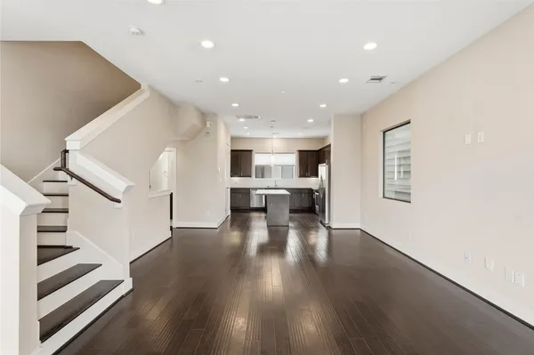 a view of kitchen with furniture and wooden floor