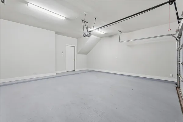 an empty room with a ceiling fan and a ceiling fan