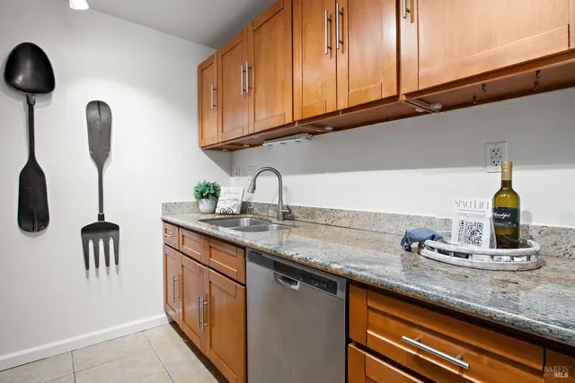 a kitchen with appliances cabinets and a sink