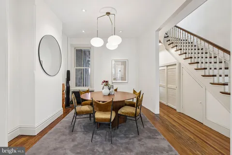 a dining room with furniture and window