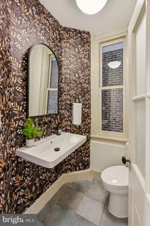 a kitchen with cabinets stainless steel appliances and a window