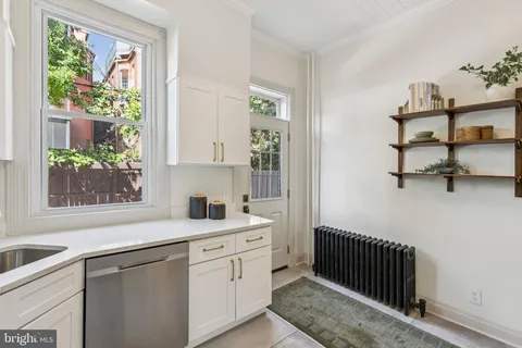 a view of a hallway view with wooden floor and staircase