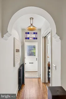 a view of a entryway door with wooden floor