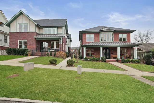 a view of a yard in front of a brick house
