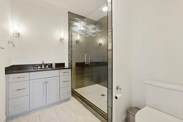 a utility room with cabinets washer and dryer