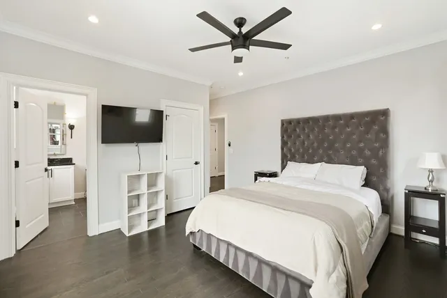 a bedroom with a bed and a window