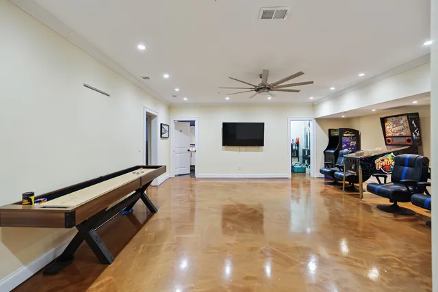 a living room with furniture a rug and a chandelier