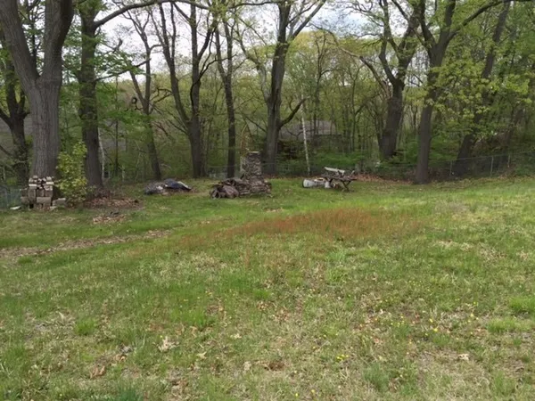 a fire hydrant in the middle of a field
