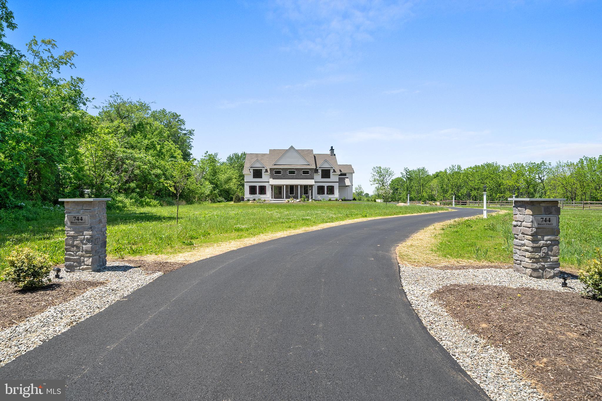 744 Broad Street Perkasie, PA 18944 - Photo 2 of 55 a view of a house with a big yard and a large trees