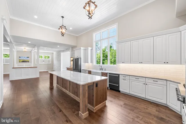 a view of room with window and hallway