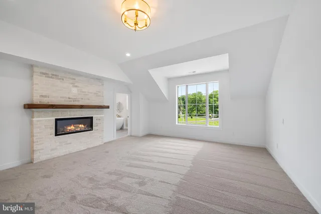 a spacious bathroom with a sink toilet and a mirror