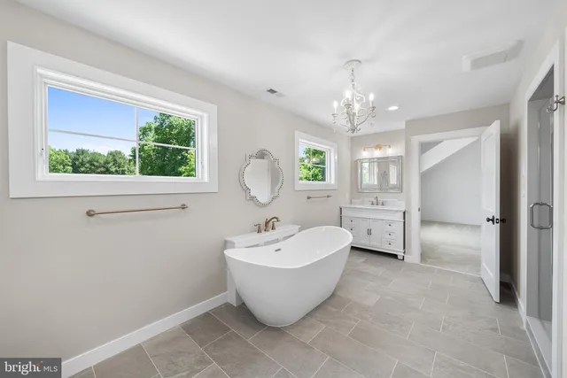 a view of bathroom with a sink and a shower