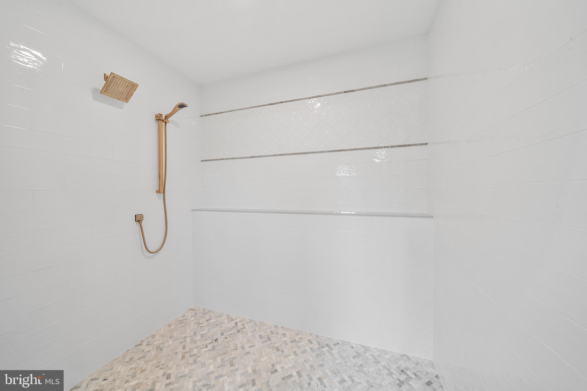 744 Broad Street Perkasie, PA 18944 - Photo 34 of 55 a bathroom with a glass shower door