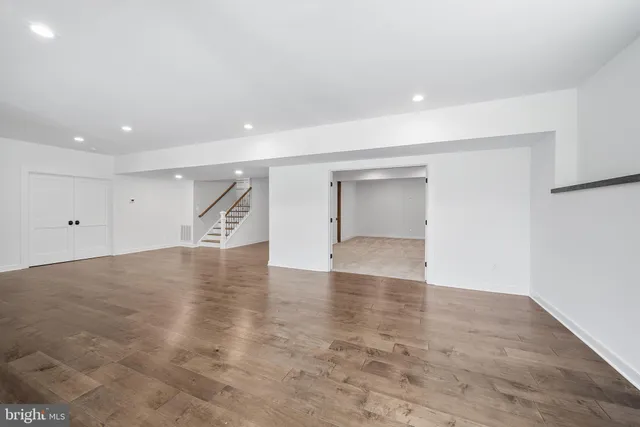 an aerial view of a house with a garden and trees