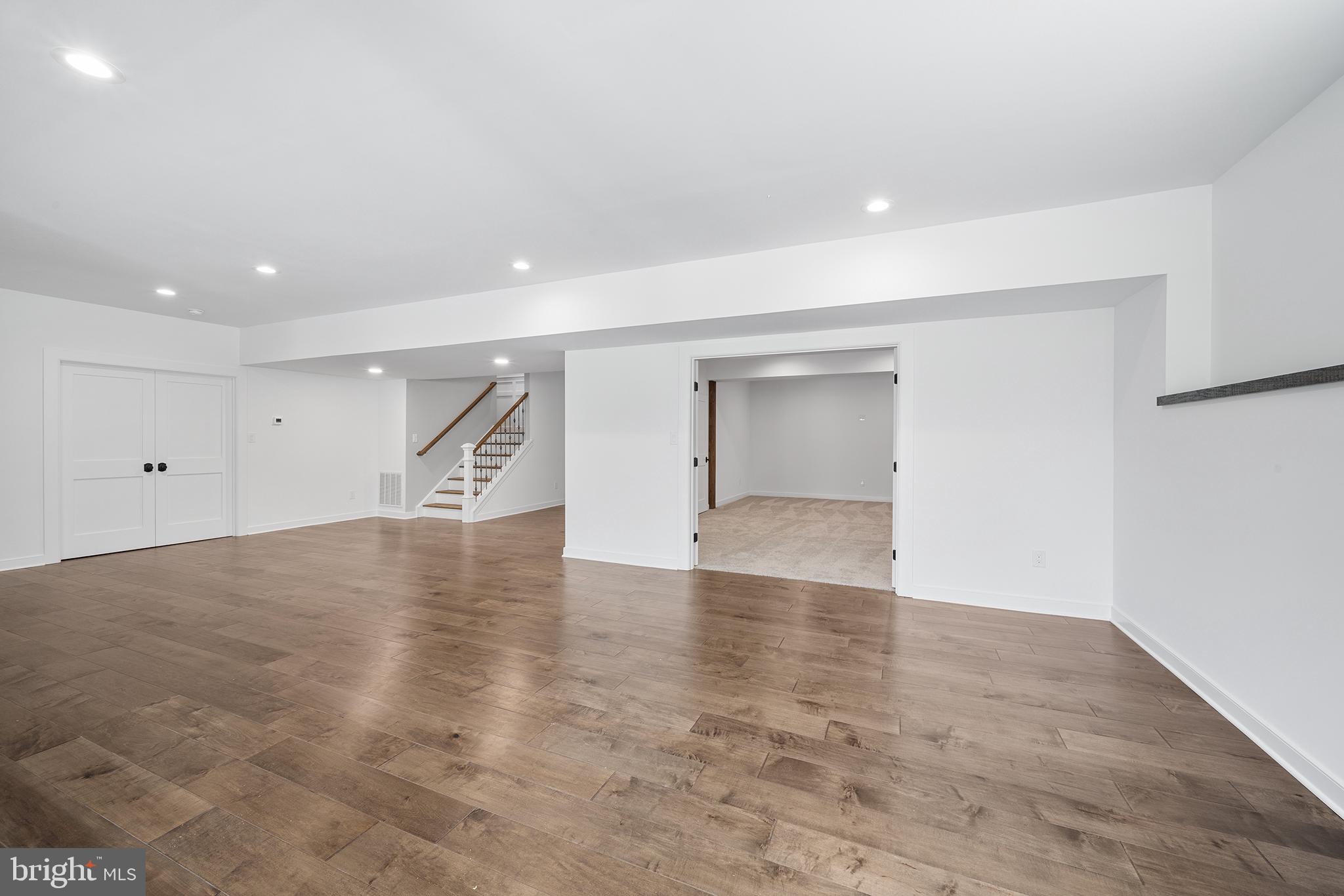 744 Broad Street Perkasie, PA 18944 - Photo 47 of 55 an empty room with wooden floor and windows