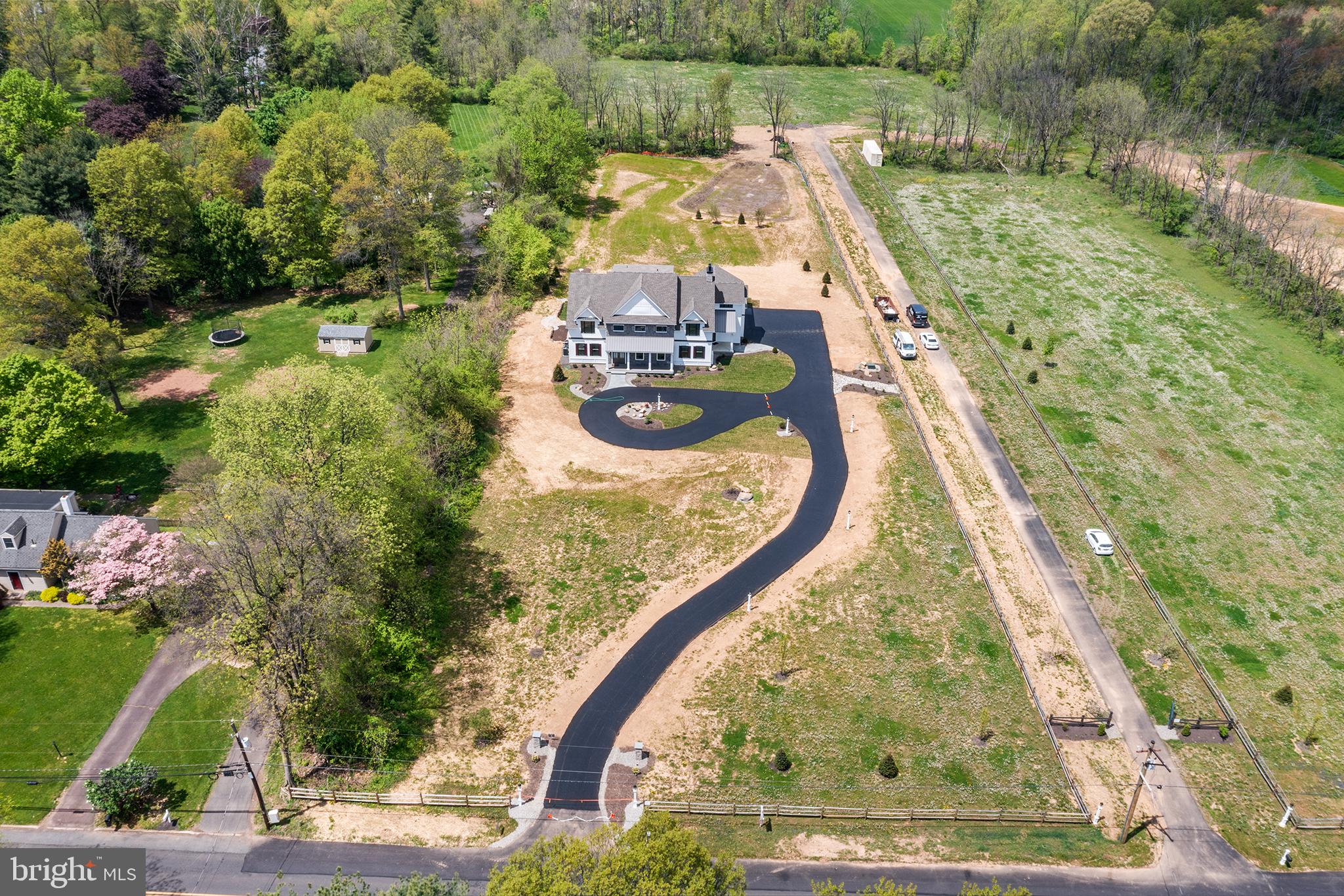 744 Broad Street Perkasie, PA 18944 - Photo 52 of 55 an aerial view of a house with a garden and trees