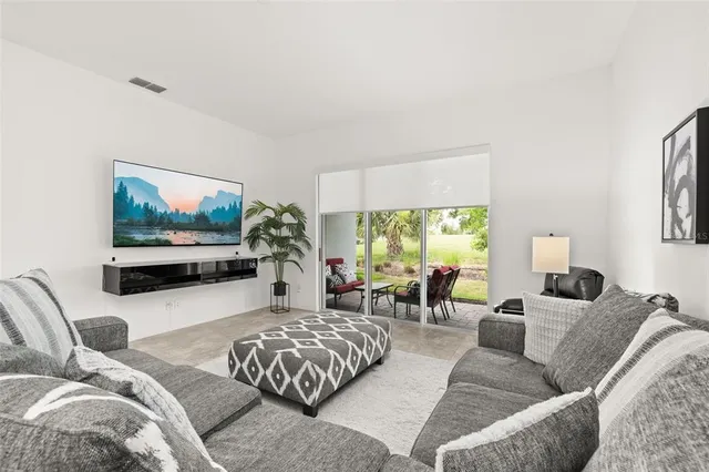 a spacious bedroom with a bed and a couch