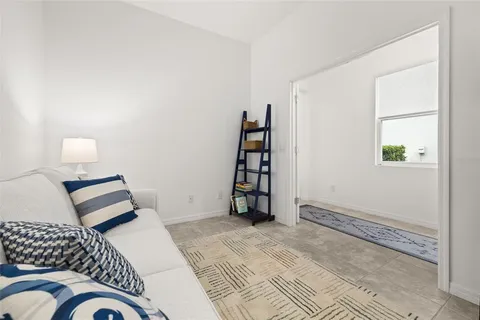 an aerial view of a city with lots of residential buildings and mountain view in back