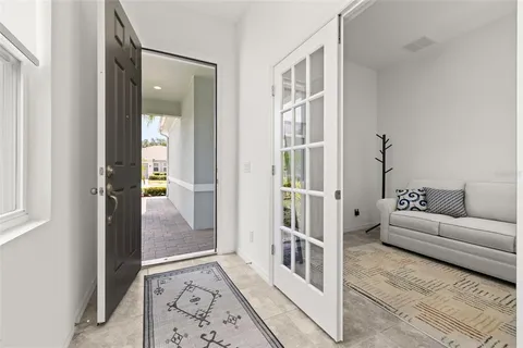 a kitchen with stainless steel appliances kitchen island granite countertop a refrigerator and a stove top oven