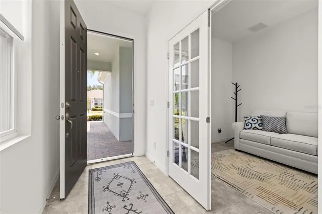 a kitchen with stainless steel appliances kitchen island granite countertop a refrigerator and a stove top oven