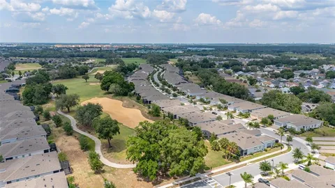 a view of a dining room with furniture large windows and wooden floor
