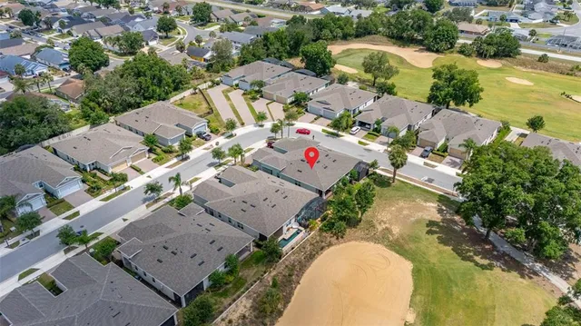 an aerial view of a house with a lake view