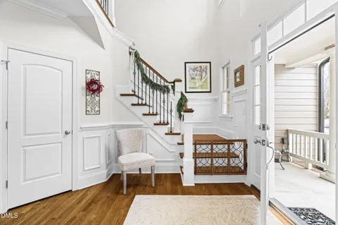 a view of entryway with wooden floor and a rug