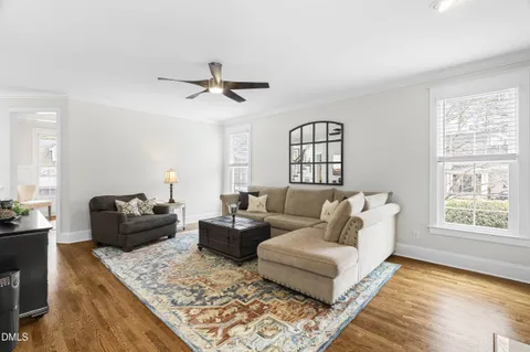a living room with furniture and a rug